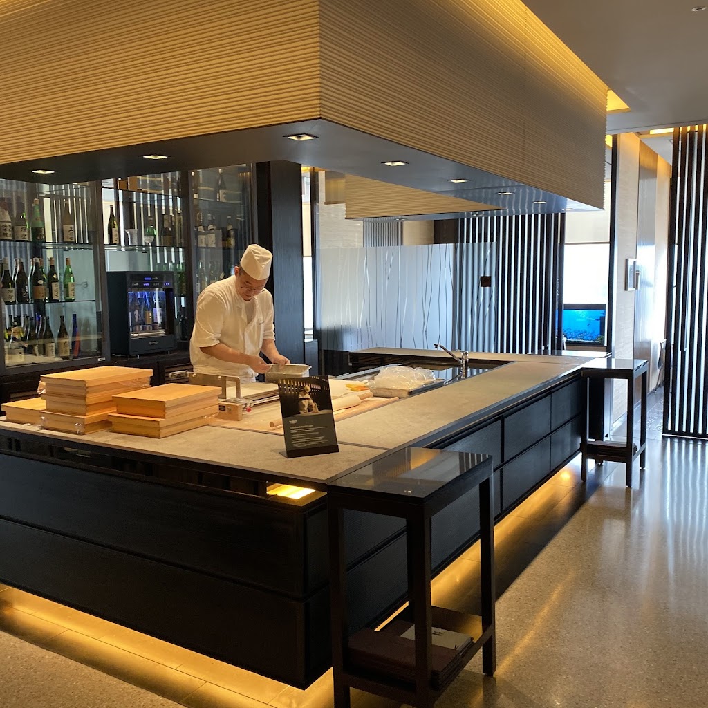 High-end sushi restaurant counter with fresh fish display